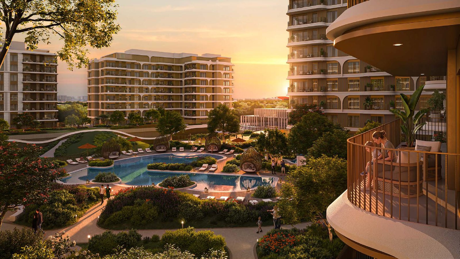 Sunset over the Canopies at Yas Point gardens with pool below and mid-rise buildings